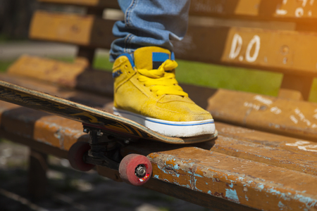 young skateboarder legs skateboarding at skateparkの写真素材