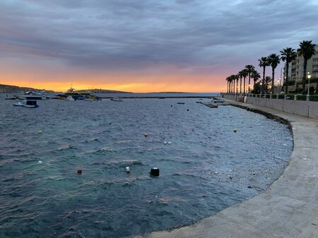 Colorfull Sunset in Saint Pauls Bay, Maltaの写真素材
