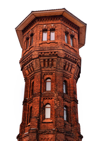 High brick tower isolated on white background.の写真素材