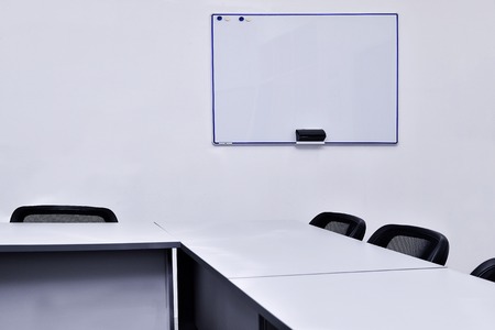 Empty meeting room in the office with tables and chairs.の写真素材