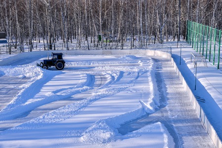 Removing snow from the pitchの写真素材
