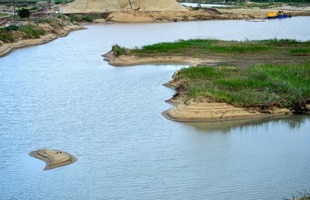 Extraction of sand, sand pit with water.の写真素材