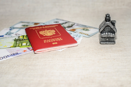 Passport, money and home - the concept of buying a property.の写真素材