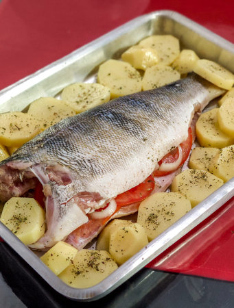 fish and vegetables. fish (Cichla ocellaris) known as peacock bass, prepared in Brazilian cuisine...