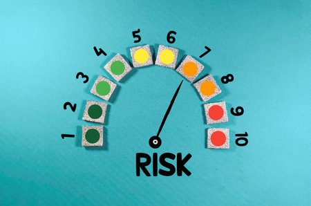 Risk level indicator rating print screen wooden cube block since low to high on blue background for Risk management and assessment conceptの写真素材