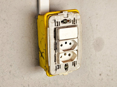 Yellow plug on white wall , plug socket, electric, plug outlet, plug background.