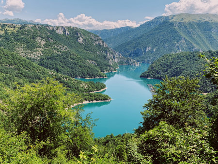 Turquoise lake in the mountains, Montenegro. Piva national park. Pivsko oko, Pluzine, Montenegroの写真素材