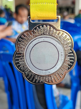 Silver Medal with Yellow Ribbon for Award Ceremony Recognitionの写真素材