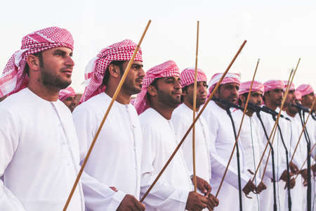Emirati Men perform a Yawalah traditional dance in  Al Dafrah festival in September 12, 2014 Abu Dhabi, UAEのeditorial素材