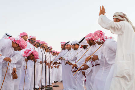 Men perfume yola dance in western region Abu Dhabi in December 9, 2012のeditorial素材