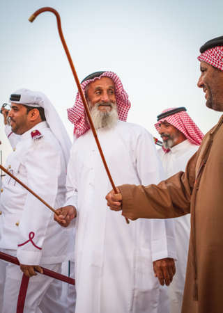 Men perfume yola dance in western region Abu Dhabi in December 9, 2012のeditorial素材