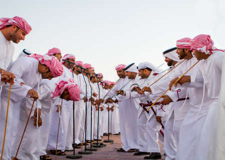 Men perfume yola dance in western region Abu Dhabi in December 9, 2012のeditorial素材