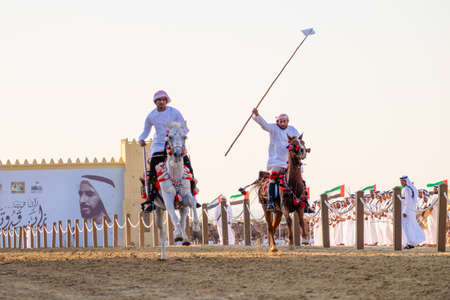 Camel Riders race at the Al Wathba Sheikh Zayed Heritage Festival in Al Wathba, Abu Dhabi, 22 Nobember 2014のeditorial素材