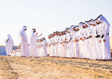 Men perfume yola dance  in SHEIKH ZAYED HERITAGE FESTIVAL september 22, 2014 in Abu Dhab, united arab emiratesのeditorial素材