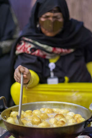 Emirati women cook traditional emirati food n western region Abu Dhabi in february 13, 2015のeditorial素材