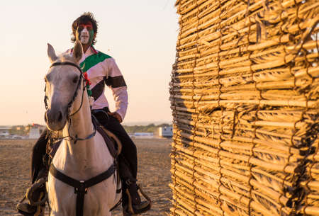 Yang man ride arabian horse in   SHEIKH ZAYED HERITAGE FESTIVAL september 22, 2014 in Abu Dhab, united arab emiratesのeditorial素材