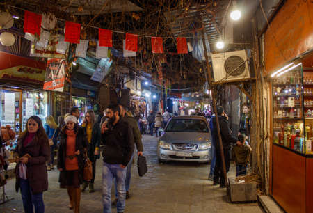 People hangouts in tradiational marketplace   in ancient City in Damascus, Syria on 22/12/2019のeditorial素材