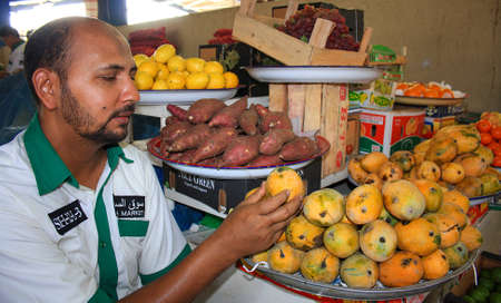 selling mango in Vegetable and fruit market in Dubai, UAE on October 3.2010のeditorial素材