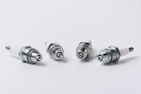 Car spark plugs on white