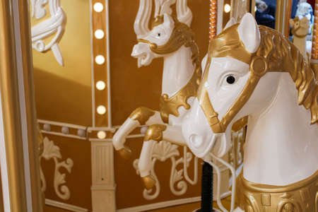 Golden and white attraction lovely and cute horses for riding children close-upの写真素材
