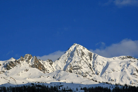 Snow covered mountains with a blue sky