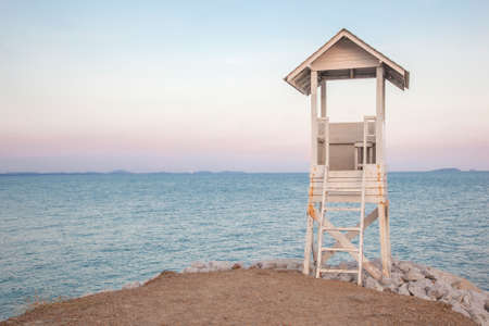 Lifeguard stand beside the beach in the evening sceneの写真素材