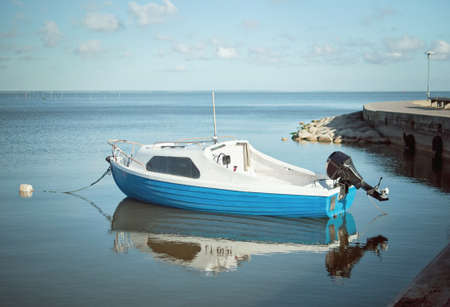 Fishing boat in the bay in Juodkrante, Lithuaniaの写真素材