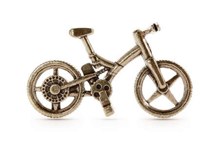 Bronze bicycle symbol on isolated backgroundの写真素材