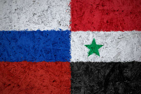 Russia and Syria flags on the concrete textureの写真素材
