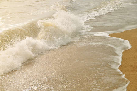 Wave splash to the shore during sunrise periodの写真素材