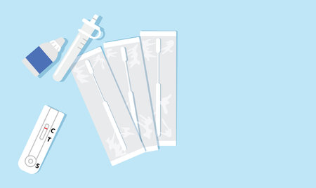 Antigen test kit (ATK), or antigen home kit flat lay, containing three swab in sealed wrappers, a...