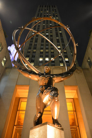 New York, USA - September 30, 2015. The statue of Atlas at the Rockfeller Center in New York City, at night, with Rockfeller Center in the background.のeditorial素材