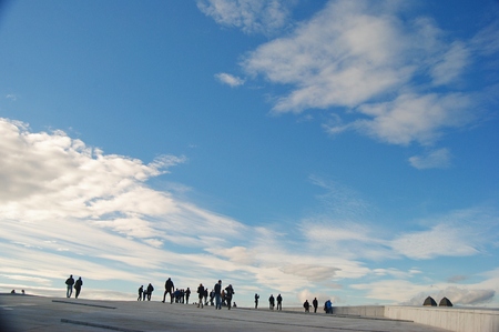 Oslo, Norway - October 25, 2014. Oslo skies. People on the roof of Oslo Opera House against the background of blue skies with clouds.のeditorial素材