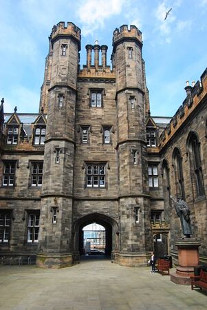 Edinburgh, United Kingdom - June 19, 2014. Towers of the New College in Edinburgh, with statues and people.のeditorial素材