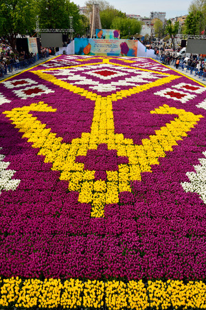 Istanbul, Turkey - April 22, 2017. Tulip carpet with geometrical patterns at Sultanahmet square in Istanbul, with people.のeditorial素材