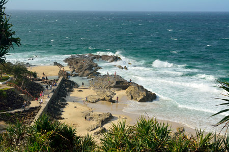 Tweed Heads, Gold Coast, Queensland, Australia - January 13, 2018. Rocky coastline at Point Danger headland on the Gold Coast of Queensland, with people.のeditorial素材