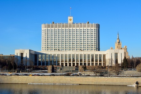 Moscow, Russia - March 24, 2018. Exterior view of the Government House across the river, in Moscow, Russia, with cars.のeditorial素材