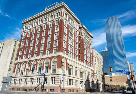Dallas, Texas, United States of America - December 31, 2016. Street view in downtown Dallas, TX, on the intersection of Main St and S Houston St, with Dallas County Records Building Complex, surrounding buildings and cars.のeditorial素材