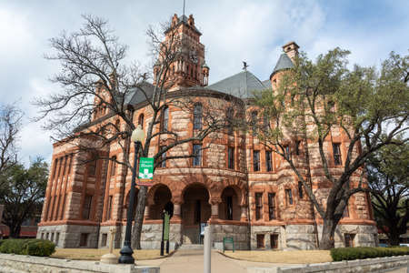 Waxahachie, Texas, United States of America - January 21, 2017. Exterior view of Ellis County Courthouse in Waxahachie, TX, with trees.のeditorial素材