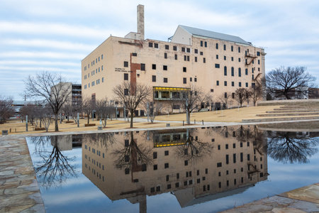 Oklahoma City, Oklahoma, United States of America - January 18, 2017. Exterior view of the Oklahoma City National Memorial Museum in Oklahoma City, OK, with reflection in the Reflecting Pool.のeditorial素材
