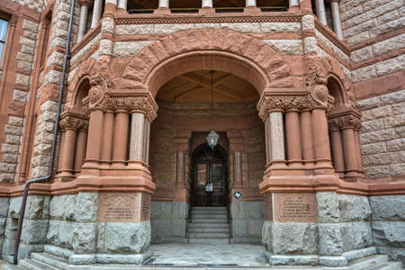 Waxahachie, Texas, United States of America - January 21, 2017. Elements of exterior design of Ellis County Courthouse in Waxahachie, TX, with entrance portal and door.のeditorial素材