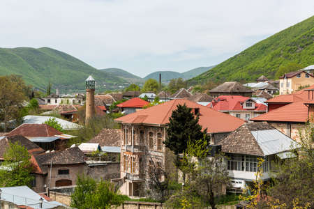 Sheki, Azerbaijan - April 29, 2019. View over downtown area of Sheki town in Azerbaijan, with historical buildings and mosque.のeditorial素材
