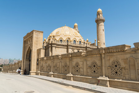Baku, Azerbaijan - May 9, 2019. Exterior view of Taza Pir mosque in Baku, with people. Its...