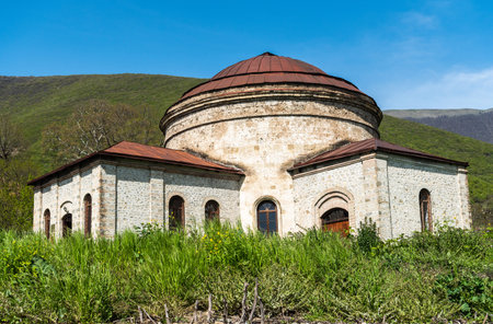 Sheki, Azerbaijan - April 29, 2019. Exterior view of dome-roofed circular church building, probably...