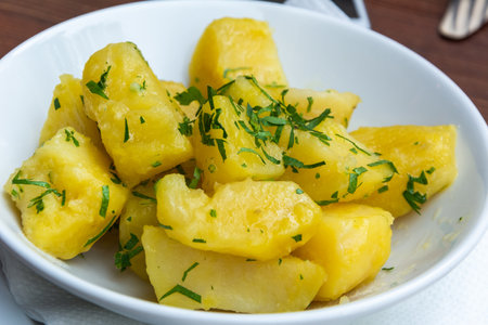 Plate of boiled potato in parsley in Austria.の写真素材