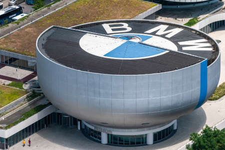 Munich, Germany â July 1, 2016. Aerial view of the BMW Museum in Munich, with people. The silver bowl-shaped futuristic building was designed by the architect of the BMW Headquarters, the Viennese professor Karl Schwanzer.のeditorial素材