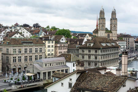 Zurich, Switzerland â June 25, 2016. View over downtown Zurich towards Grossmunster Church, with commercial properties and people.のeditorial素材