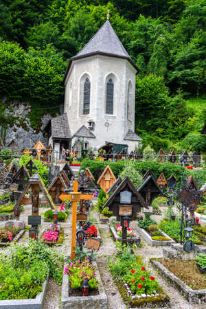 Hallstatt, Austria â July 9, 2016. Exterior view of Beinhaus charnel house in St Michael chapel of Hallstatt, across a cemetery.のeditorial素材