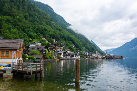 Hallstatt, Austria â July 9, 2016. View of Hallstatt town on the shore of Hallstatter See lake in Austria, with residential buildings and commercial properties.のeditorial素材