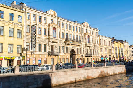 Saint Petersburg, Russia â June 15, 2017. View of Griboyedov canal and embankment in Saint Petersburg, with historic buildings, commercial properties, boats, cars and people.のeditorial素材